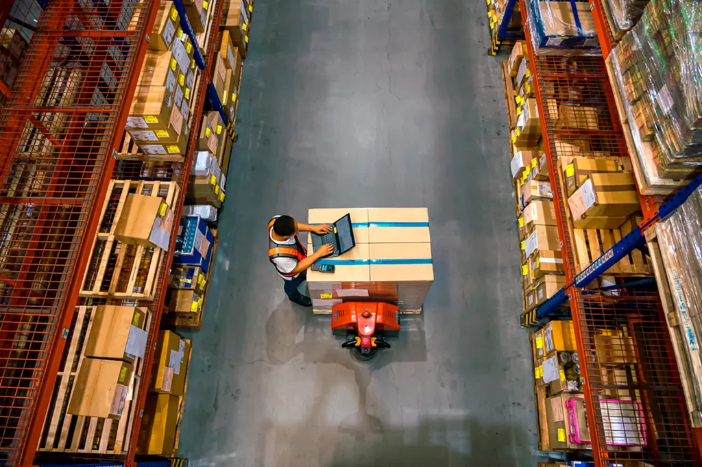 Worker using a handheld barcode scanner
