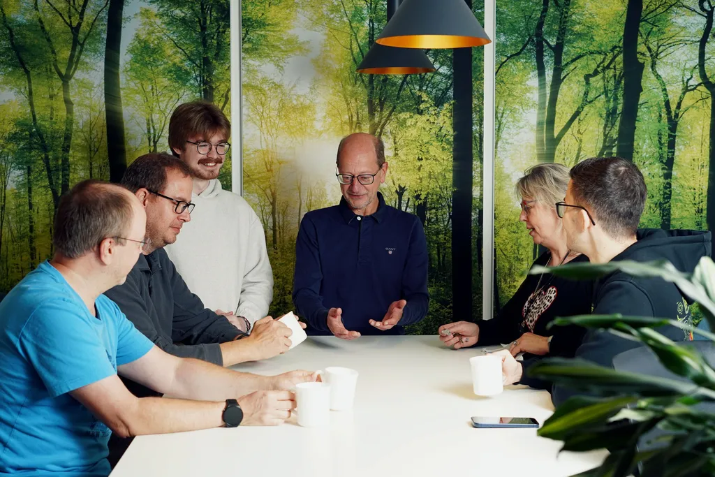 Team members collaborating in a casual office setting