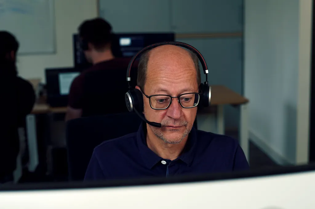 Expert providing technical assistance via headset
