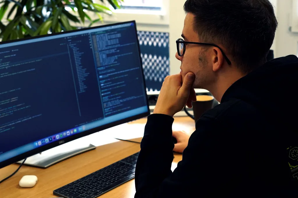 Developer looking at code, thinking